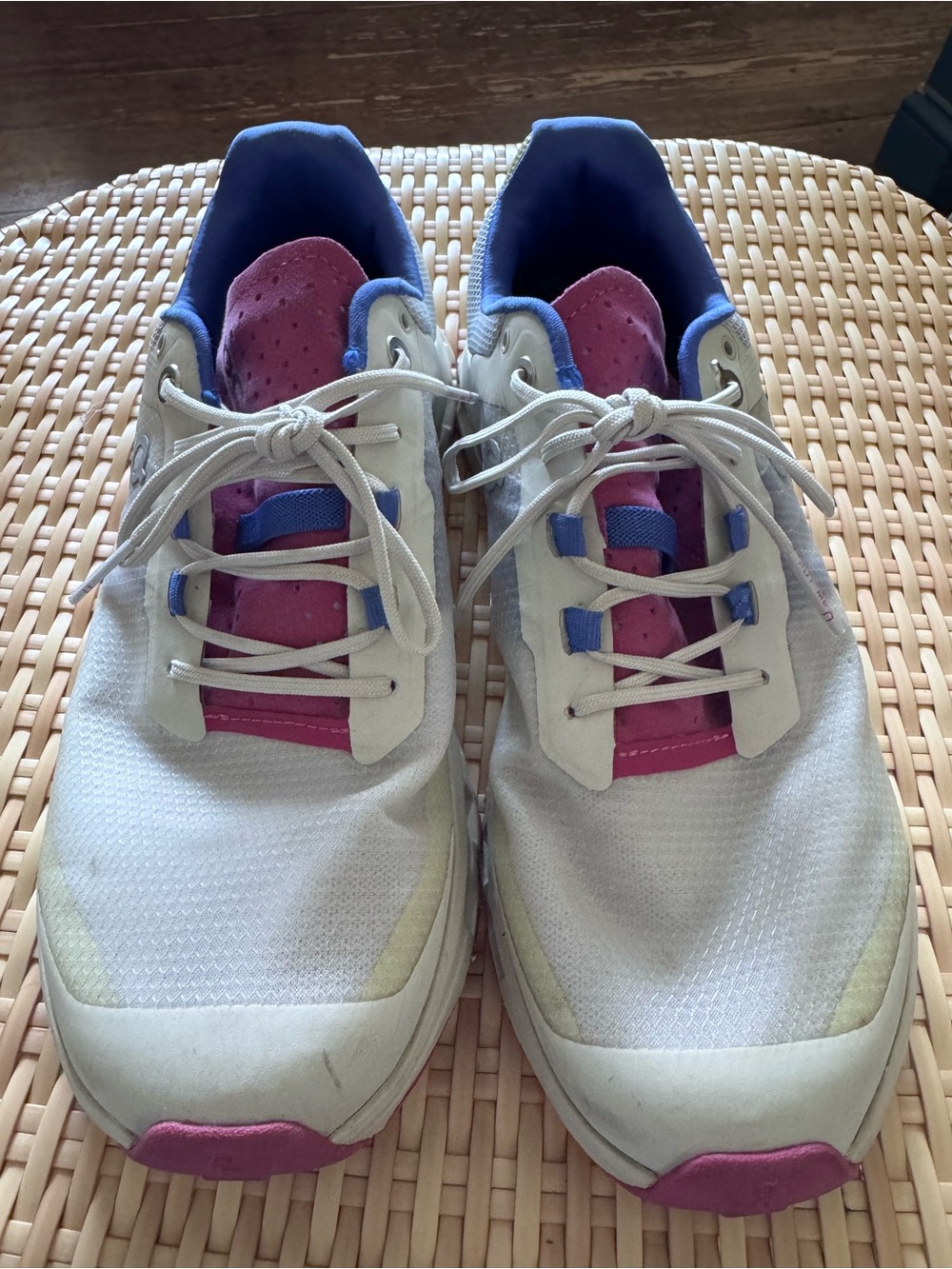 On Running White Athletic Sneakers with Pink and Blue Accents